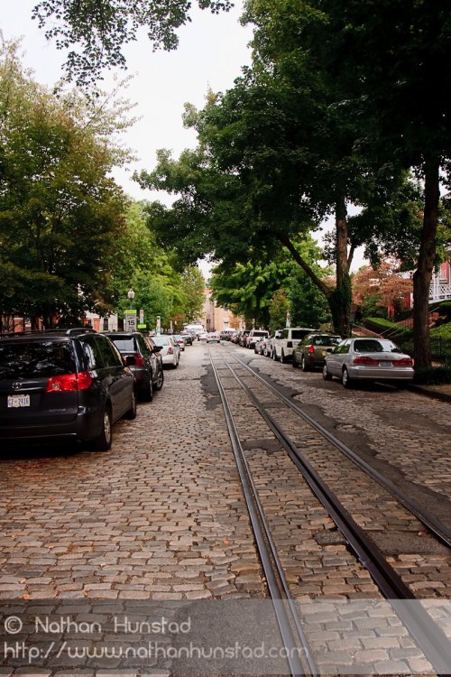 A cobblestone street with a cablecar line in Georgetown